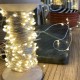 Silver Univers led garland on vintage wooden coil