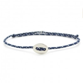 Silver button on a navy blue and white paracord bracelet