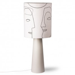 Printed faces on a cone base table lamp