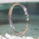 Gold platted bangle with 2 white zirconium