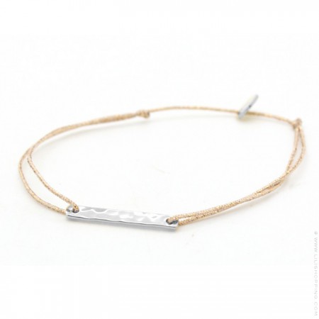 Silver hammered ring on a lurex Bracelet