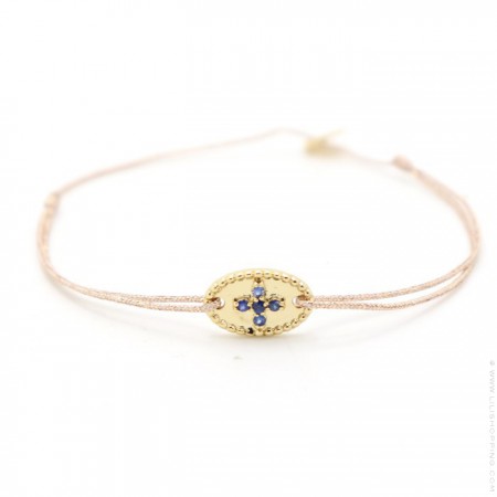 Bracelet en plaqué or et croix saphir bleus