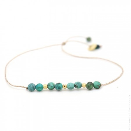 Bracelet turquoises et perles plaquées or sur lien lurex