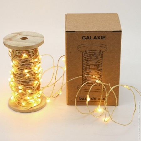Gold Galaxy led garland on vintage wooden coil