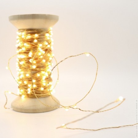 Univers led garland on vintage wooden coil