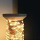 Univers led garland on vintage wooden coil