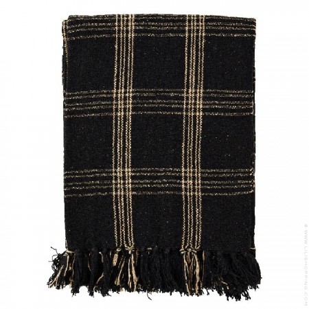 Checked and fringed black and beige throw